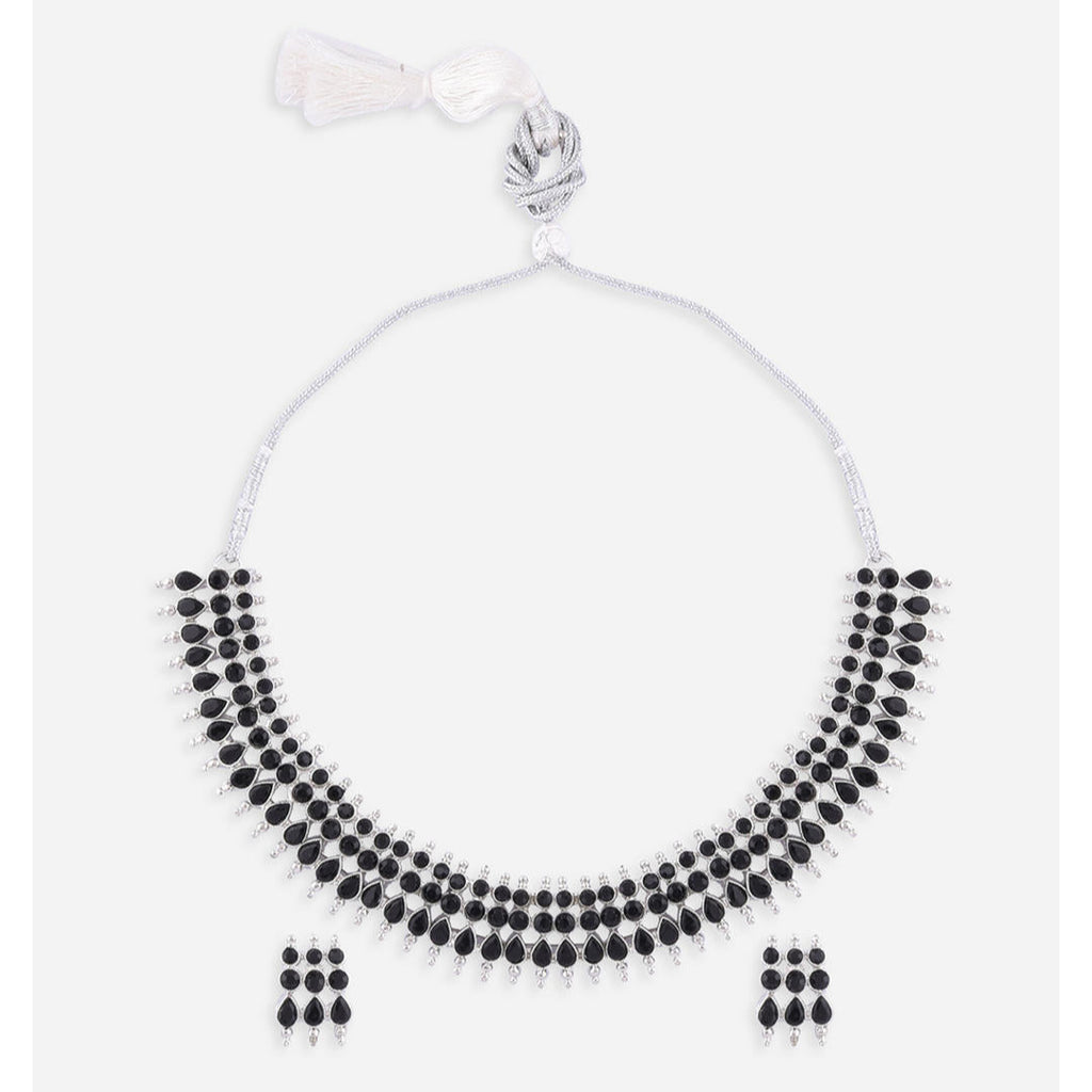 a traditional silver choker necklace with black beads and matching earrings.