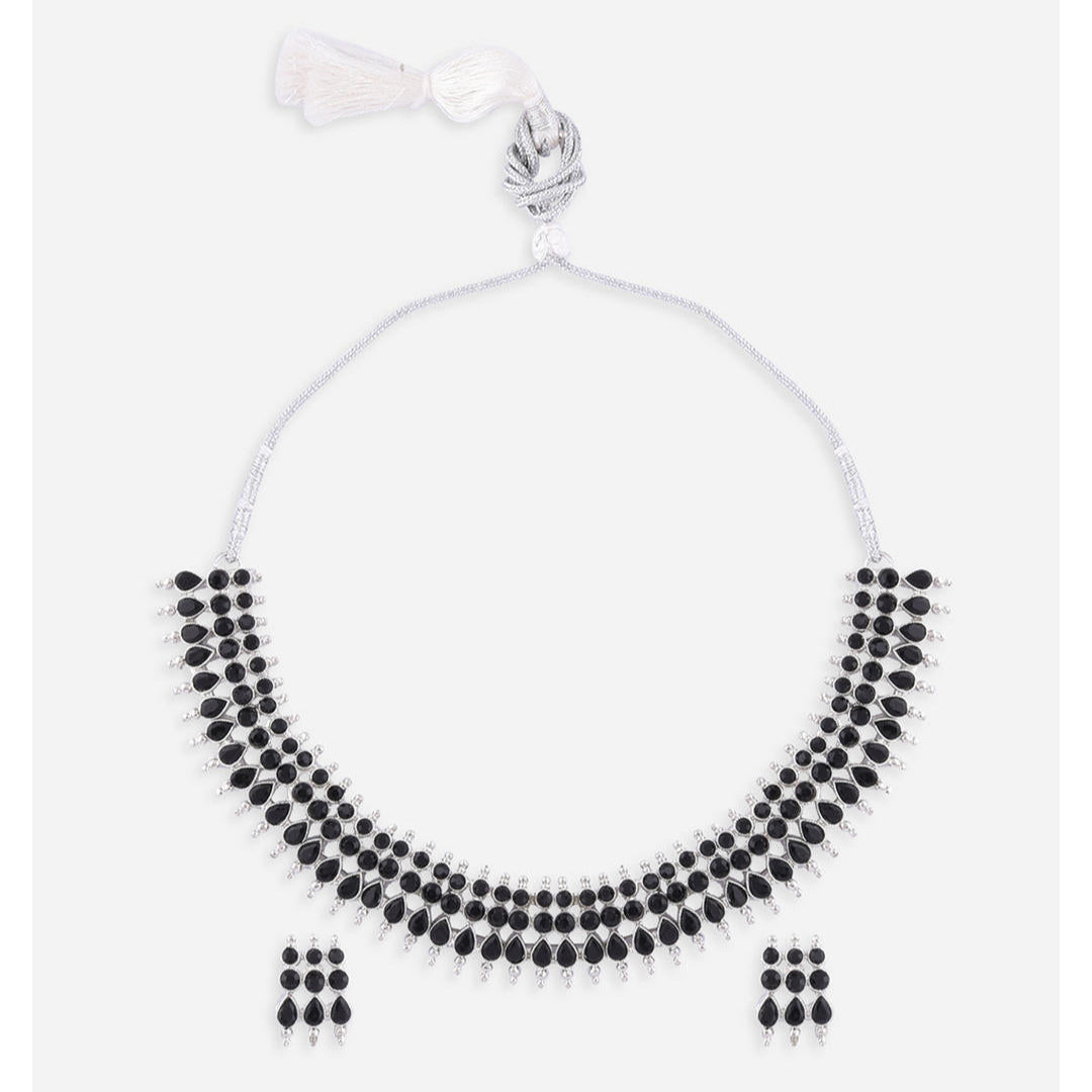 a traditional silver choker necklace with black beads and matching earrings.
