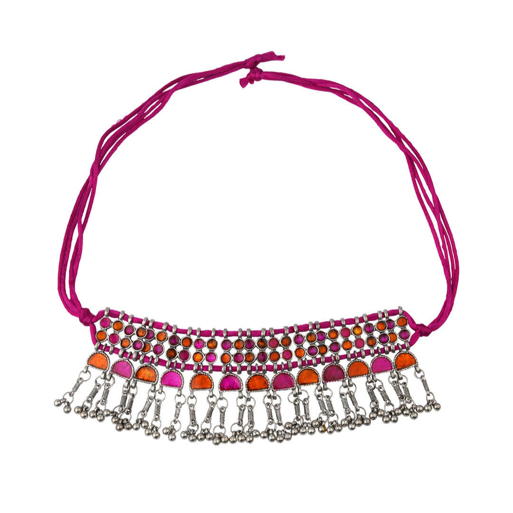 A pink and silver choker necklace with oxidised silver work and vibrant stone inlay,