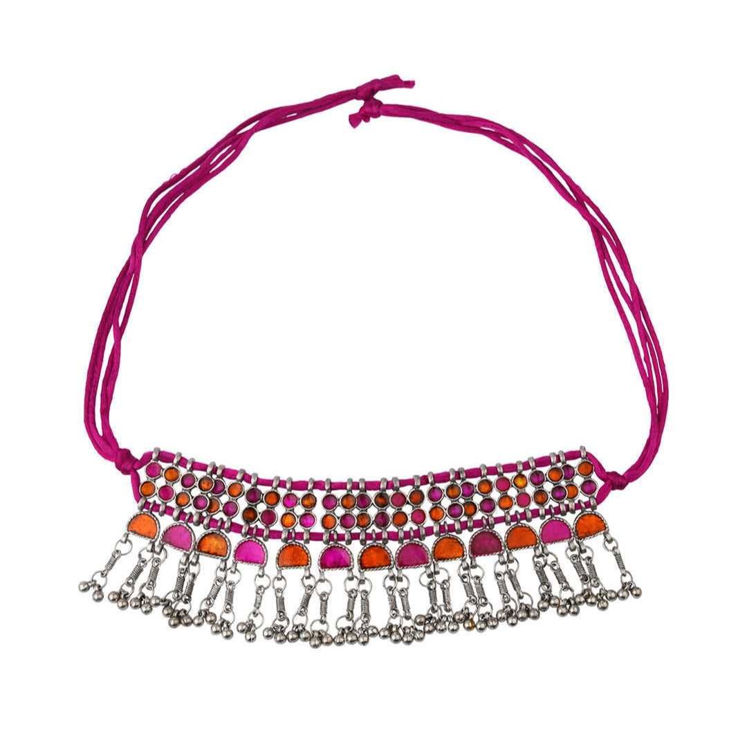 A pink and silver choker necklace with oxidised silver work and vibrant stone inlay,