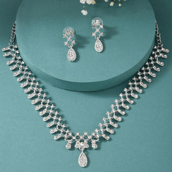 silver plated jewellery set with intricate motifs and American diamond accents