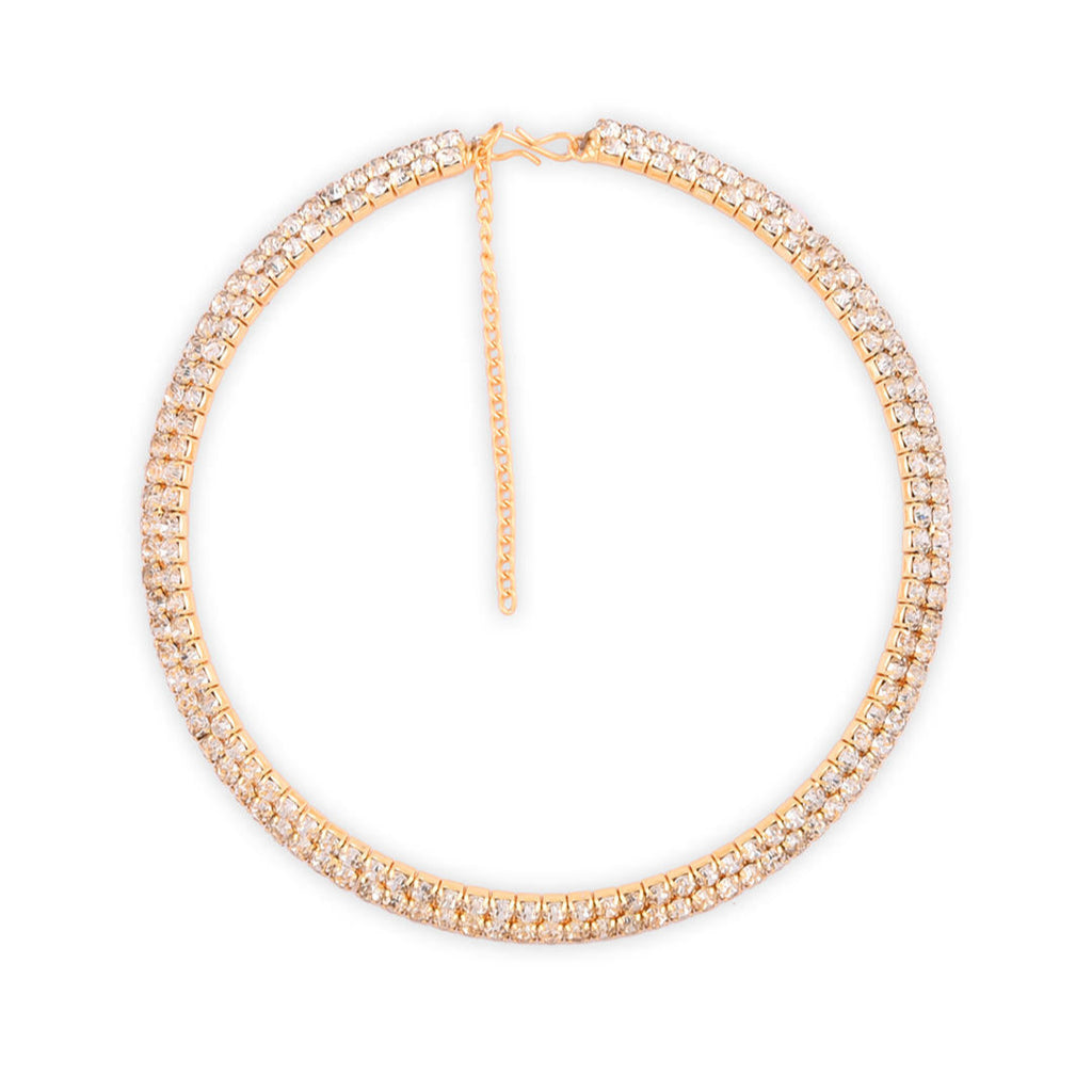 A woman wearing a gold-toned choker necklace adorned with cubic zirconia stones in a white background