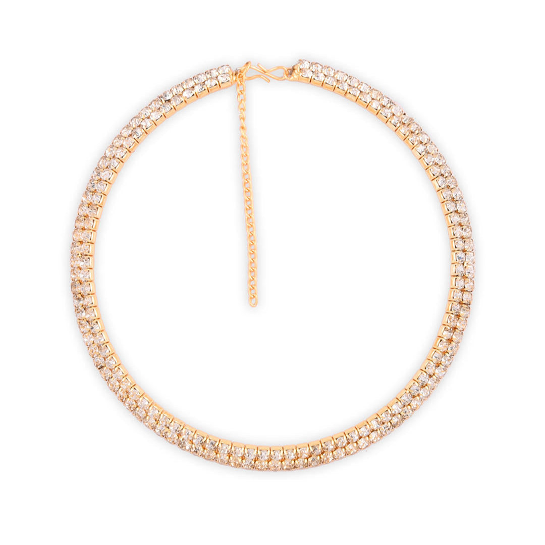 A woman wearing a gold-toned choker necklace adorned with cubic zirconia stones in a white background
