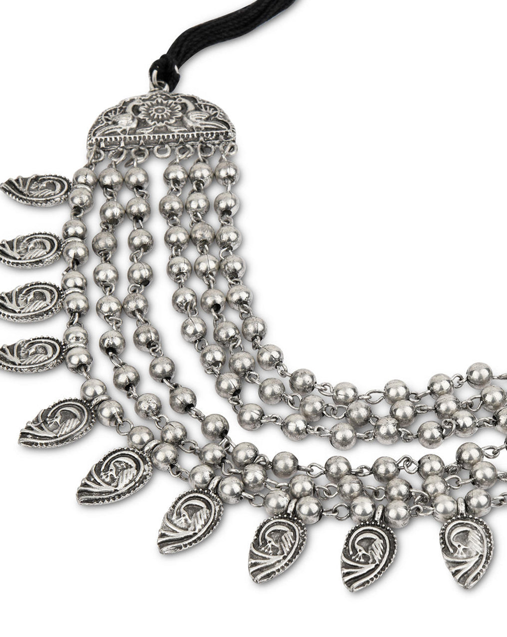 a multi-strand choker necklace with oxidized silver beads and embossed peacock charms close-up on white background