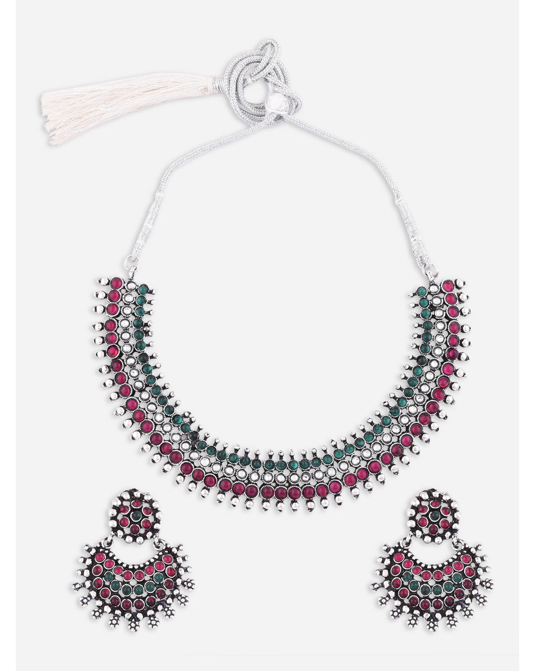A South Indian traditional silver choker necklace and earrings set with marron and kundan embellishments.