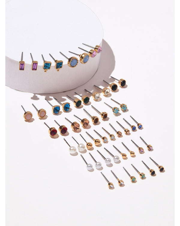 A collection of 25 pairs of gold and silver plated stud earrings displayed in a semi-circular arrangement, showcasing various designs and colors.