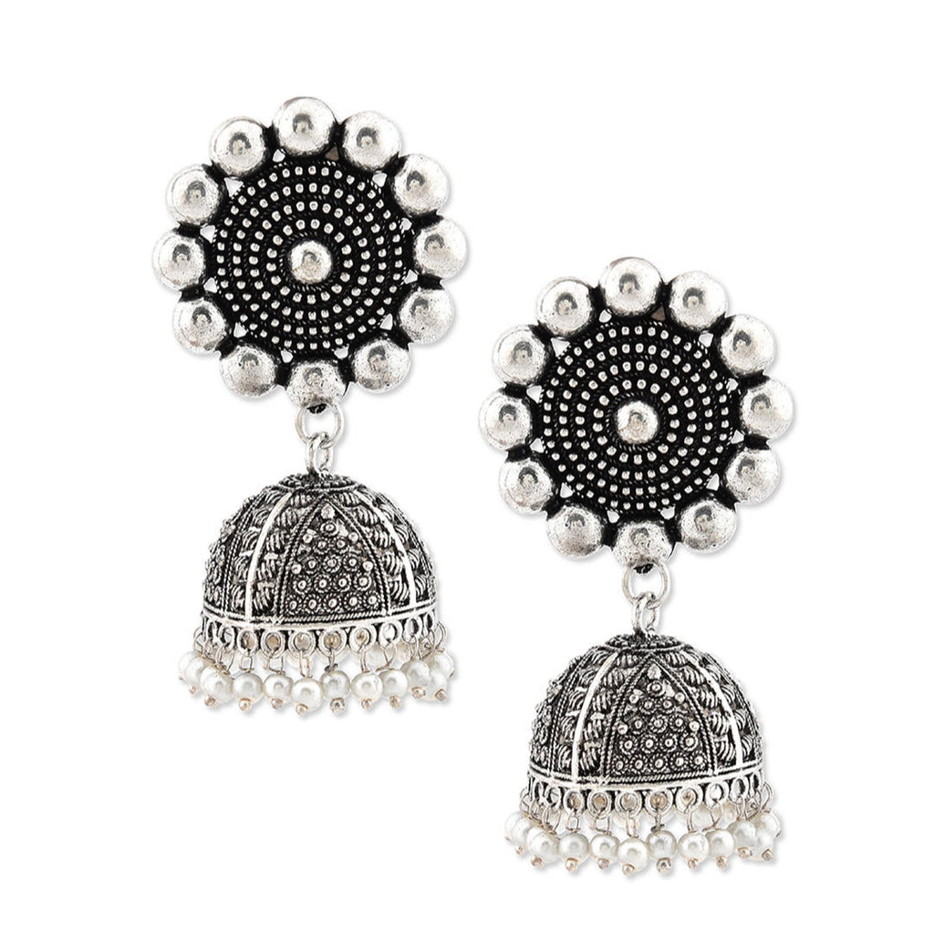 a silver oxidized matte finish floral jhumka earring.