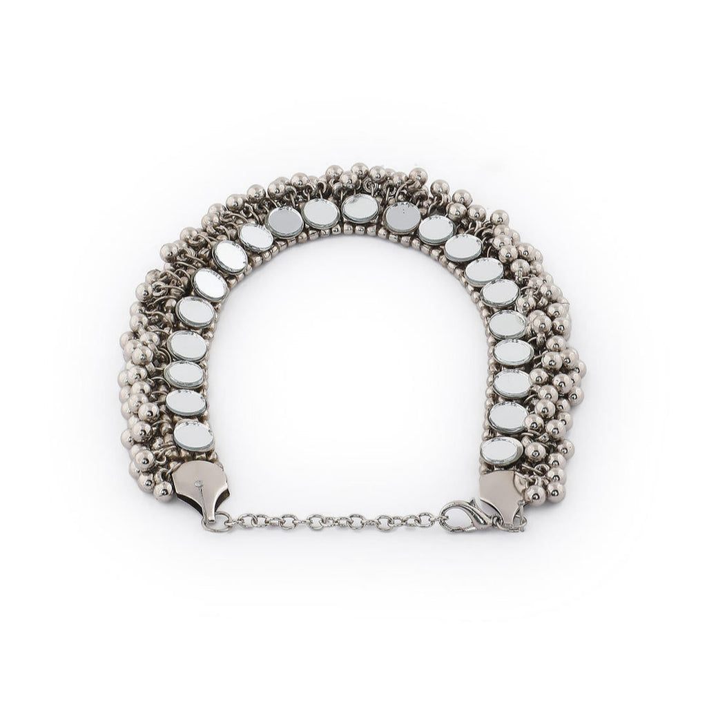 a silver oxidized choker necklace with mirrored ghungroo details side view