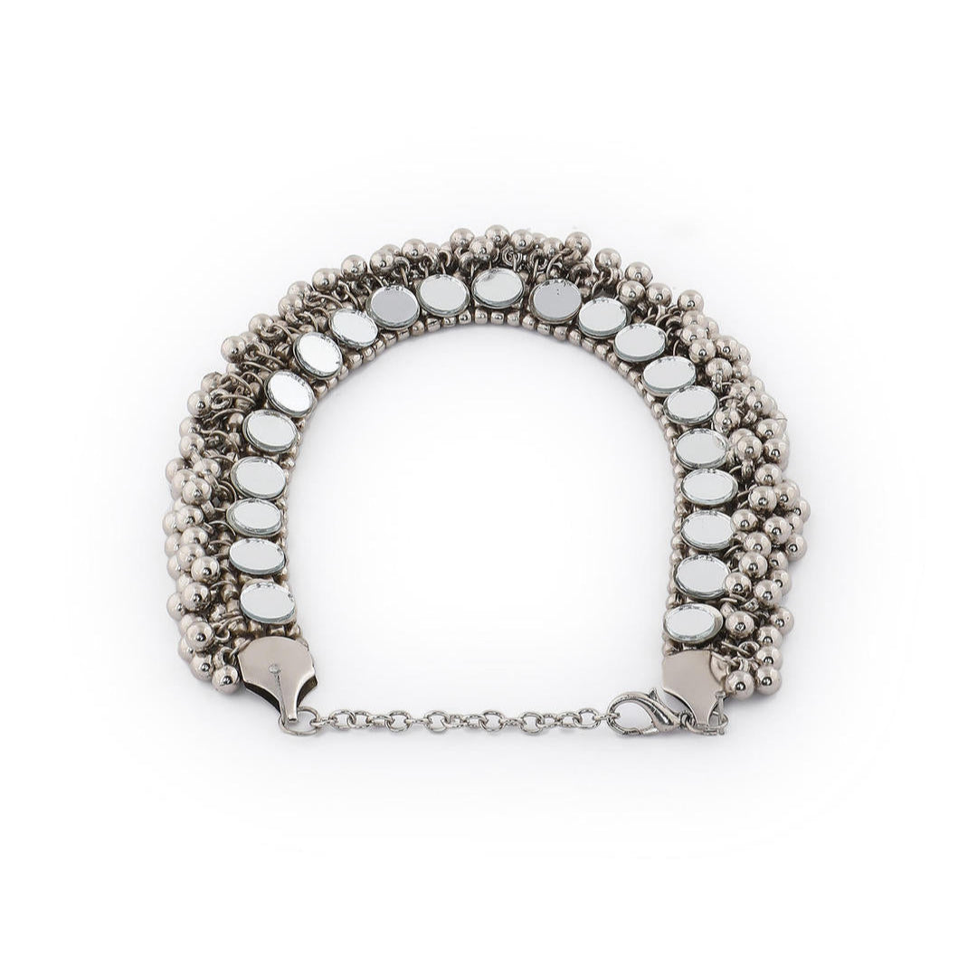 a silver oxidized choker necklace with mirrored ghungroo details side view