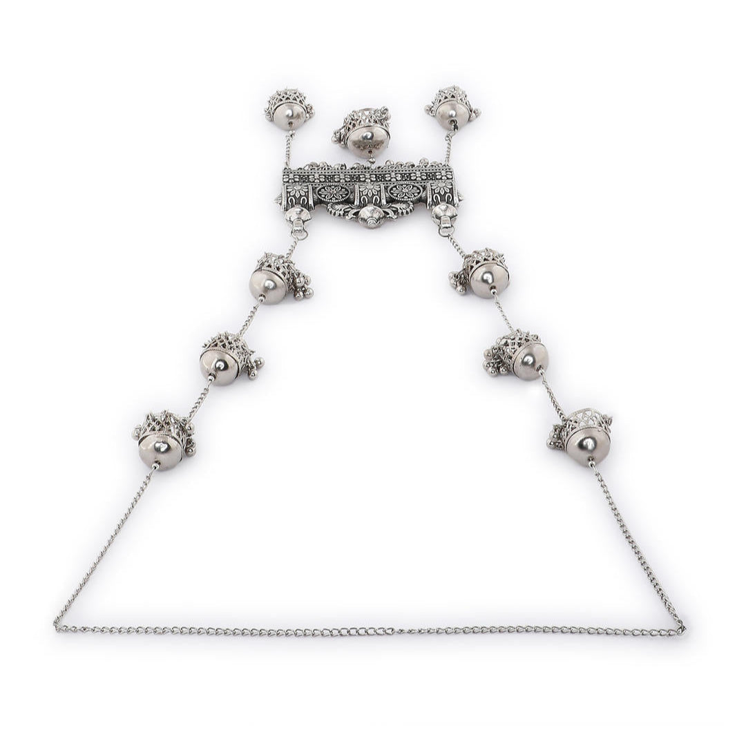 An oxidised silver long necklace with intricate chariot-inspired patterns and delicate jingles 