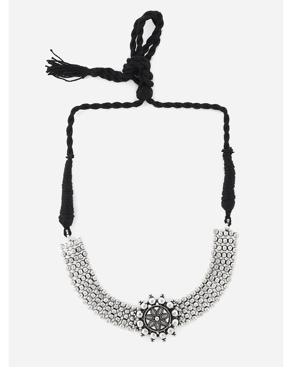 A silver oxidised choker necklace with a circular mandala-inspired pendant at the center, suspended from a black thread chain on a white background