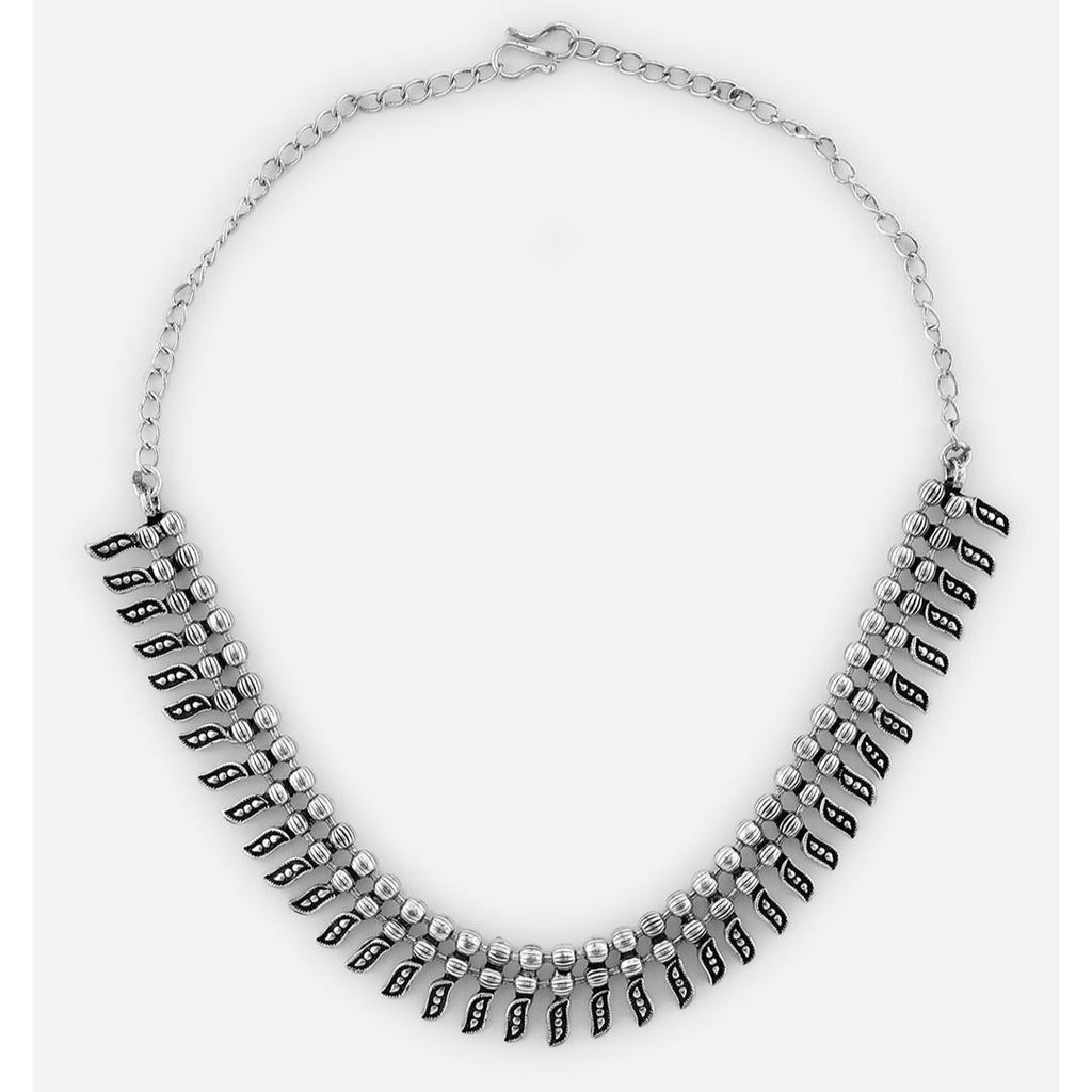 A silver-toned antiqued beaded choker necklace displayed on white background