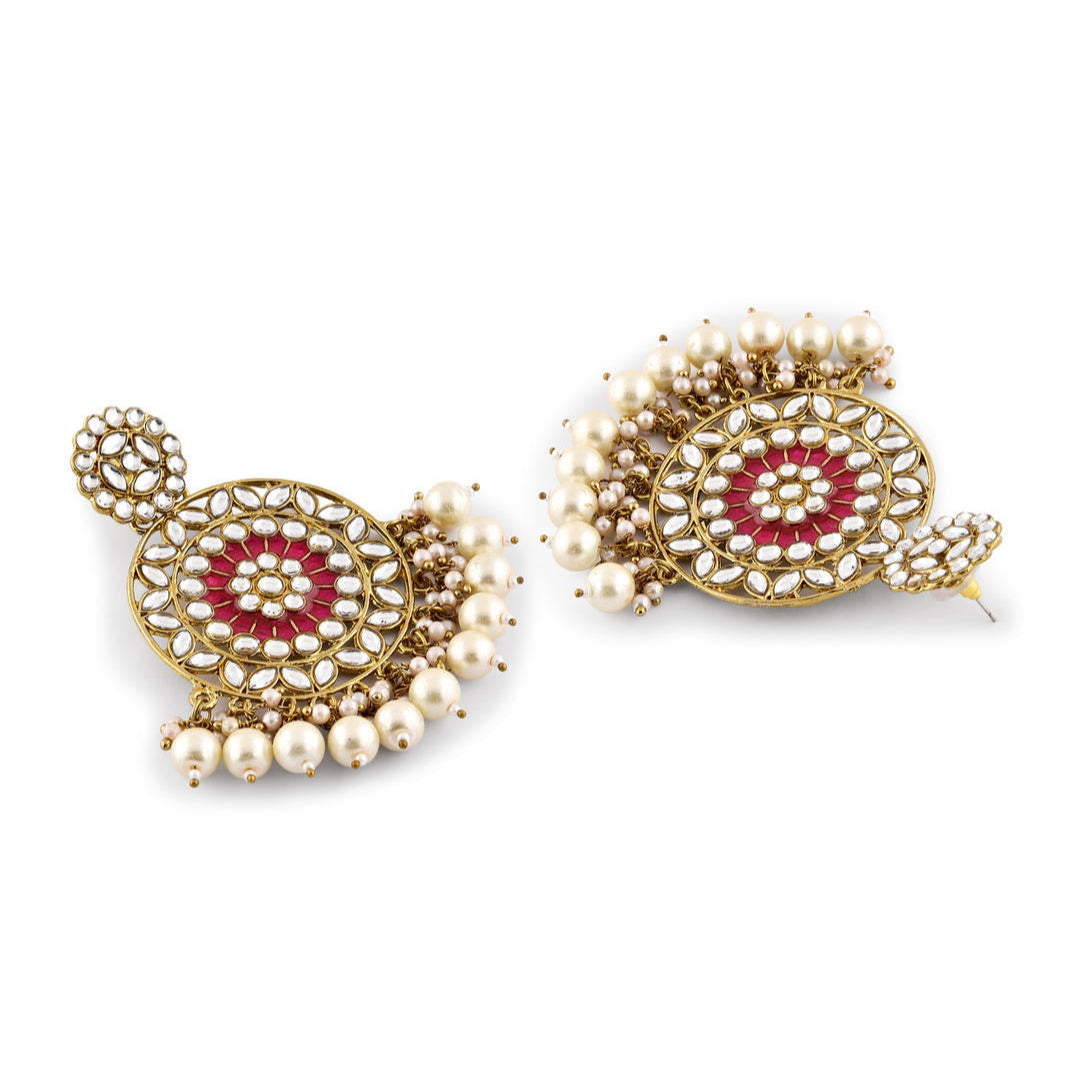 A pair of gold-plated earrings with fuchsia enamel and white pearl embellishments
