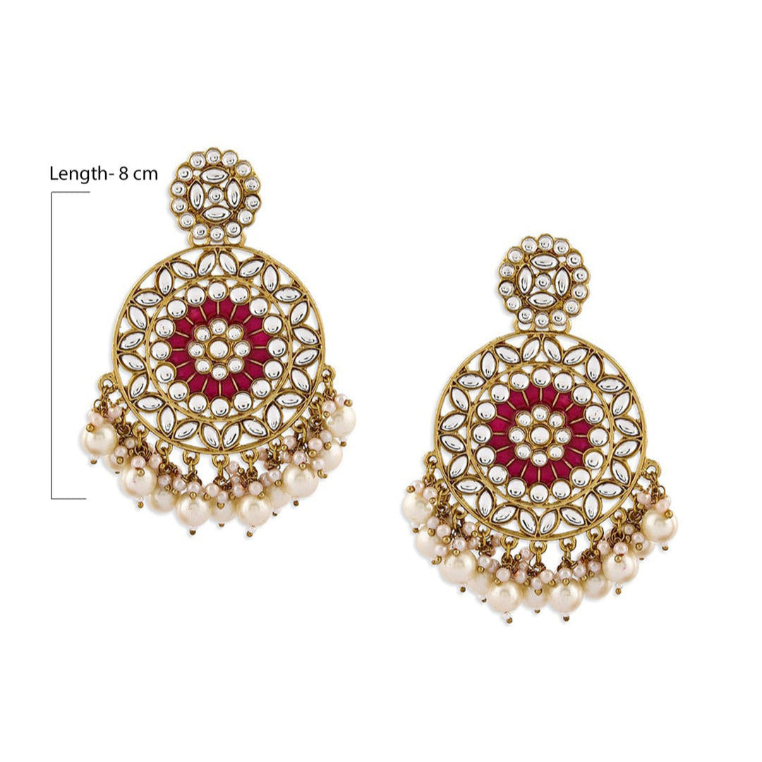 A pair of gold-plated earrings with fuchsia enamel and white pearl embellishments
