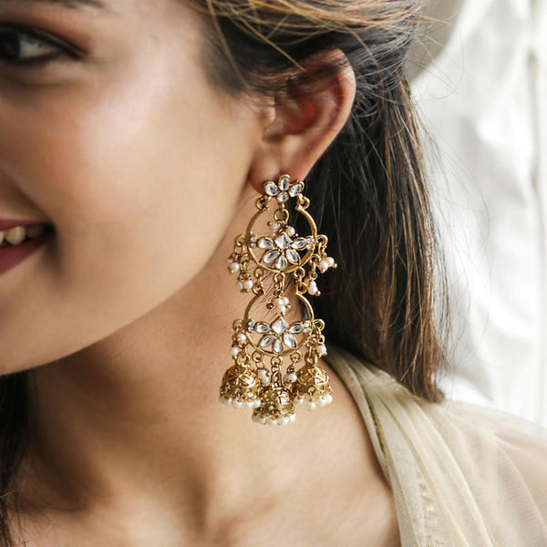 Discover Fida’s Kundan Grace Floral Gold Danglers – handcrafted floral earrings with kundan stones & crescent design, perfect for weddings & ethnic looks.