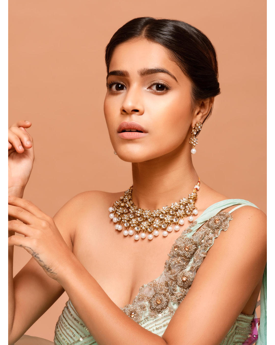 Model wearing Gold-toned kundan floral choker necklace set with pearl bead drops and matching earrings – traditional wedding jewellery