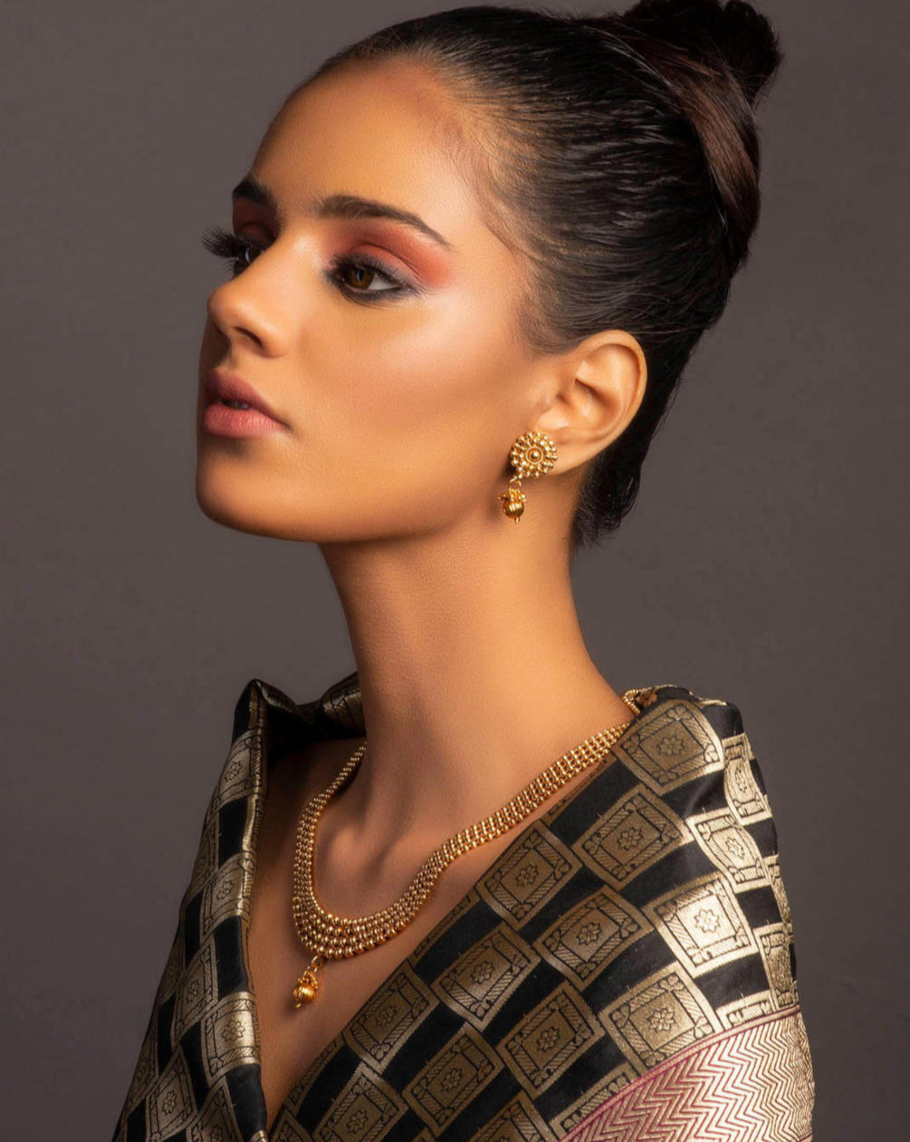 old-plated metal beaded statement jewellery set, including earrings and a necklace