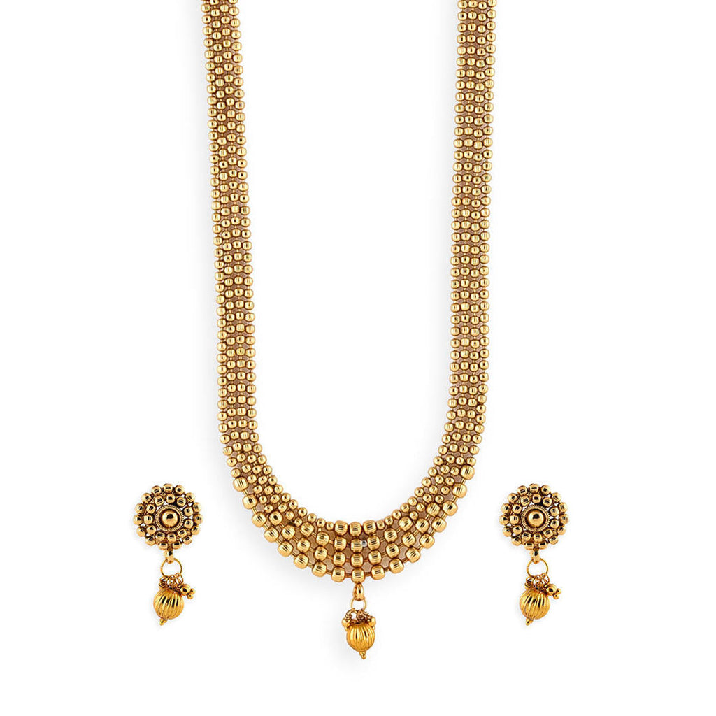 old-plated metal beaded statement jewellery set, including earrings and a necklace close-up