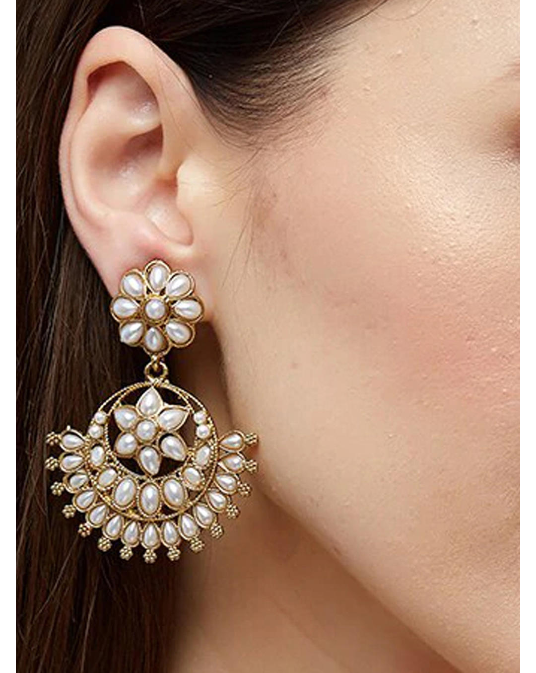 closeup of Pearl Bloom Floral White Chandbali Earrings with gold-tone floral motifs and pearl drops, handcrafted ethnic wedding jewellery