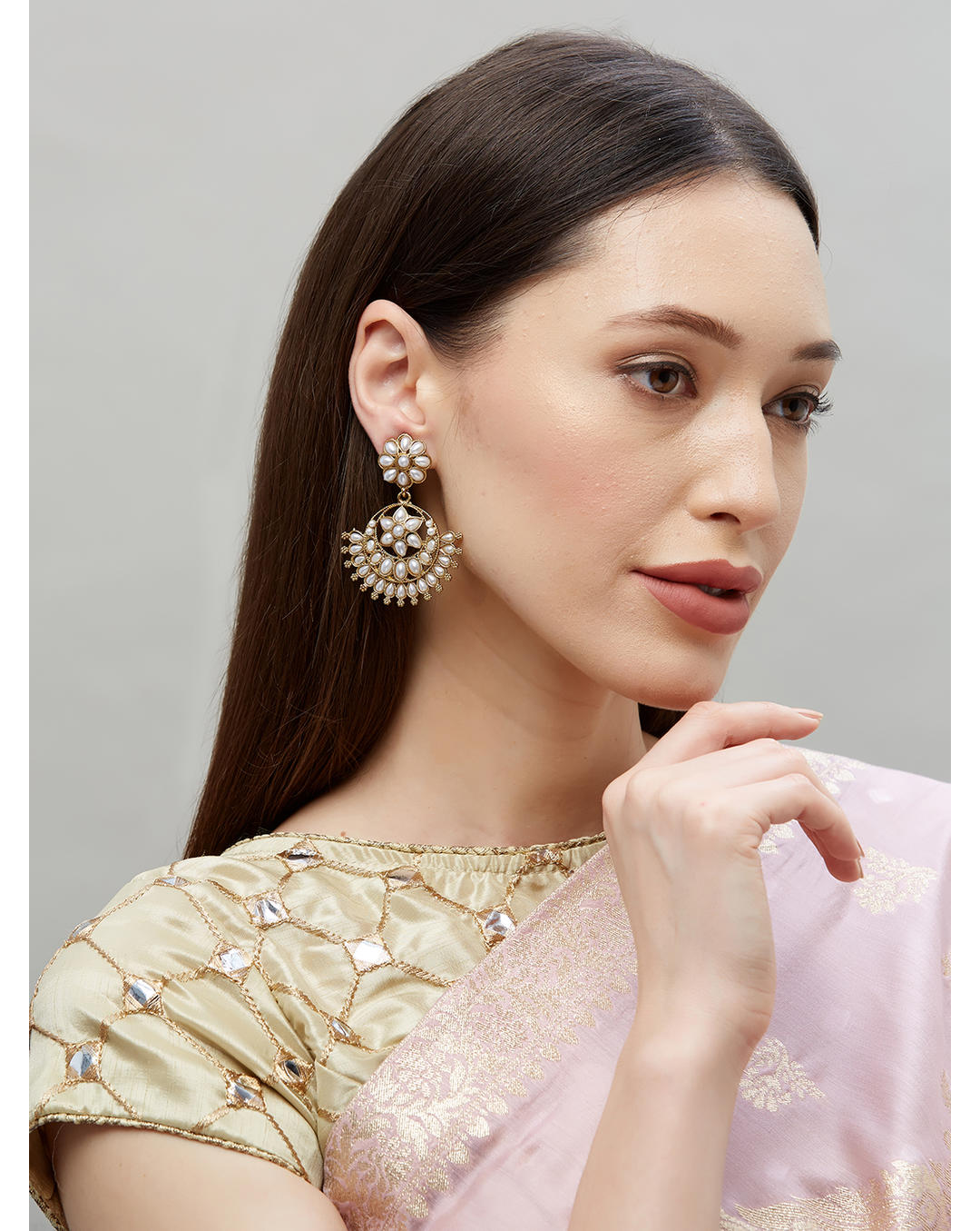 model wearing Pearl Bloom Floral White Chandbali Earrings with gold-tone floral motifs and pearl drops, handcrafted ethnic wedding jewellery