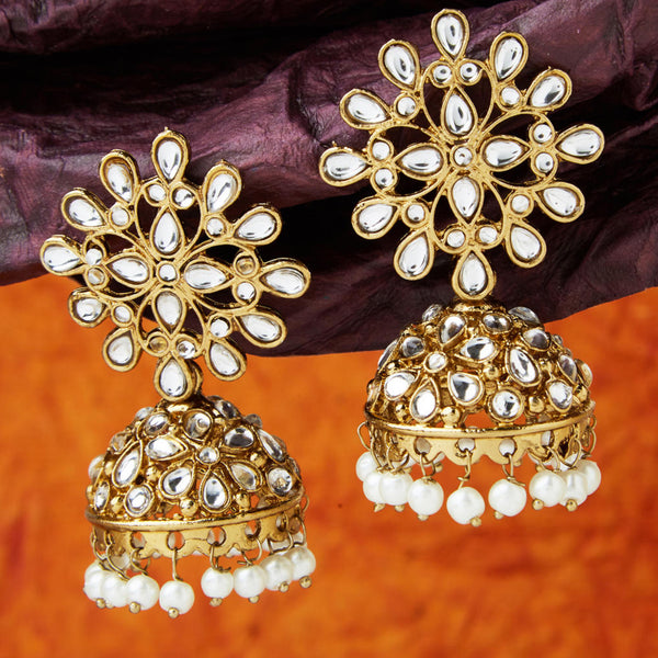 Gold-toned kundan floral chandbali earrings with intricate motifs and pearl bead drops – traditional wedding jewellery close up