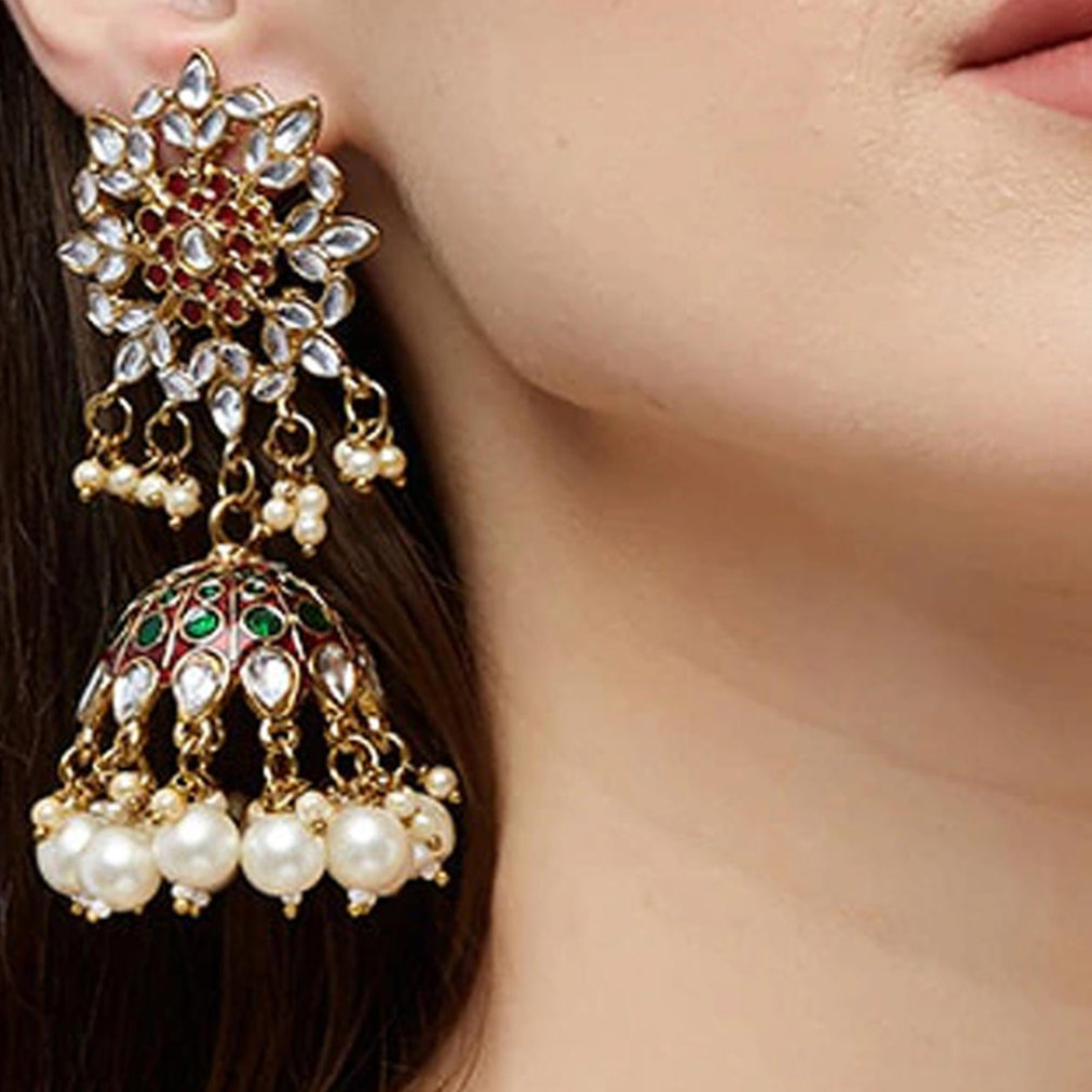 Gold plated enameled jhumka earrings with maroon kundan stones and pearl embellishments