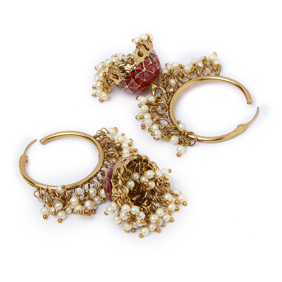 A pair of gold-plated hoop jhumka earrings with red enamel and white beads embellishments