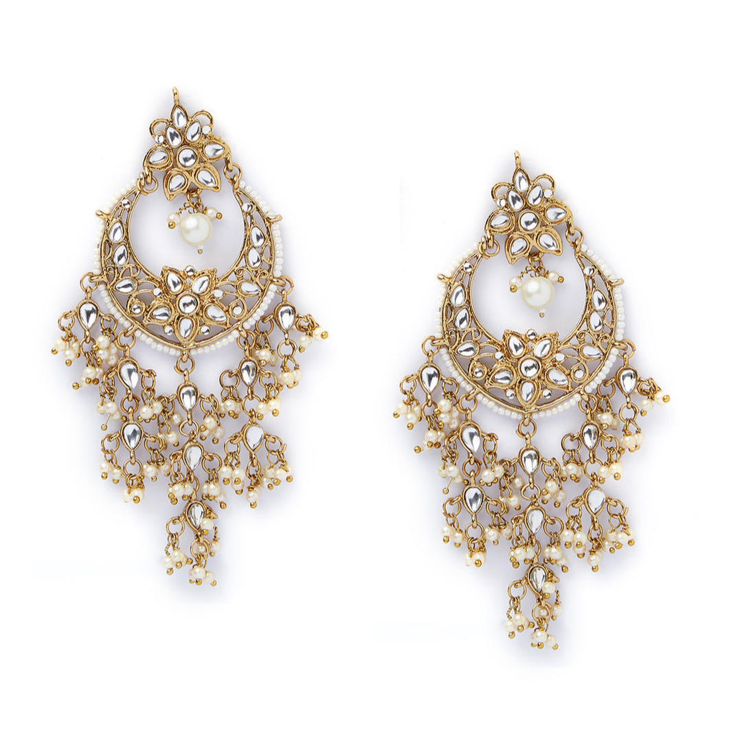 a gold-plated chandbali earring embellished with kundan beads and pearls.