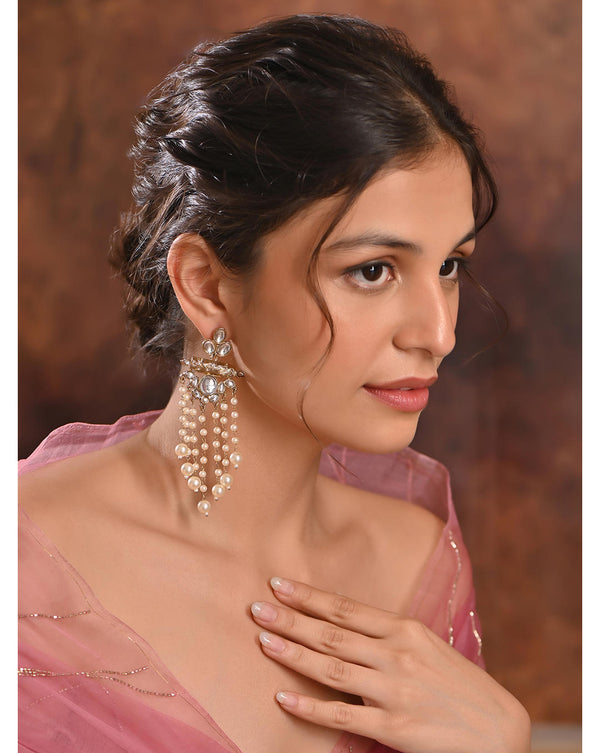 Model wearing Kundan Cascade Chandbali Earrings with pearl chain drops and white kundan stones, handcrafted Indian ethnic jewellery side view
