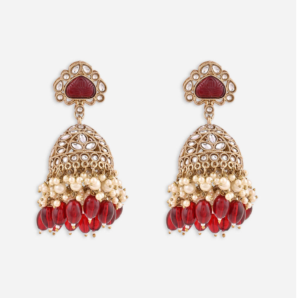 merlot burgundy jhumka earrings with kundan stones, beige pearls, and maroon beads.