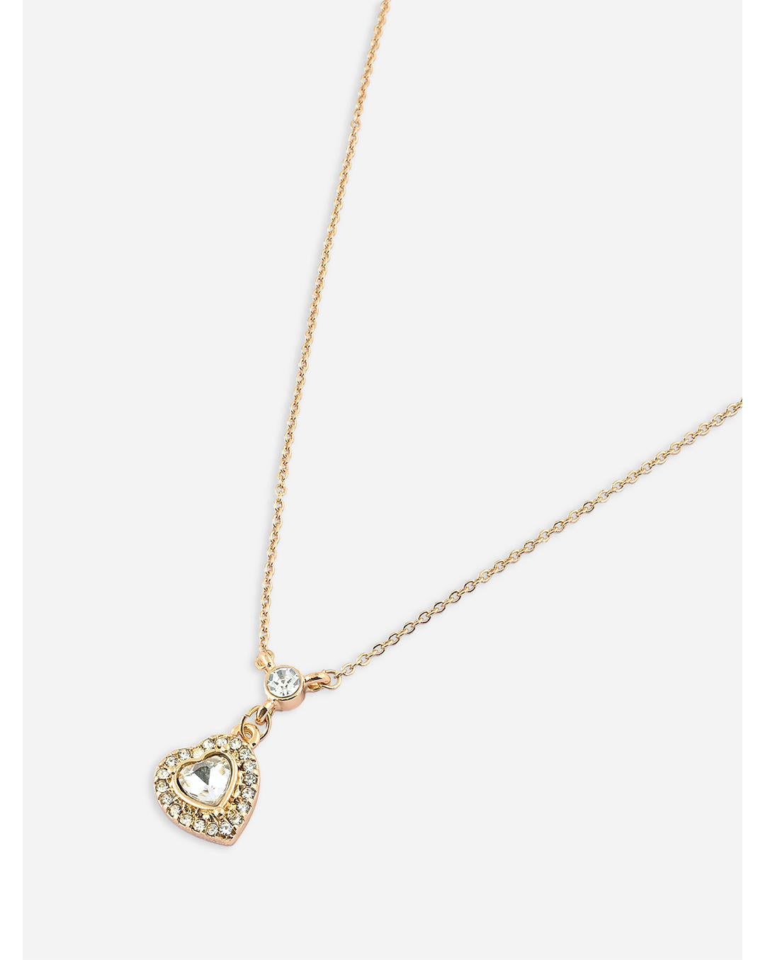 A gold-toned filigree heart pendant necklace with a central clear crystal stone, adorned with small additional stones
