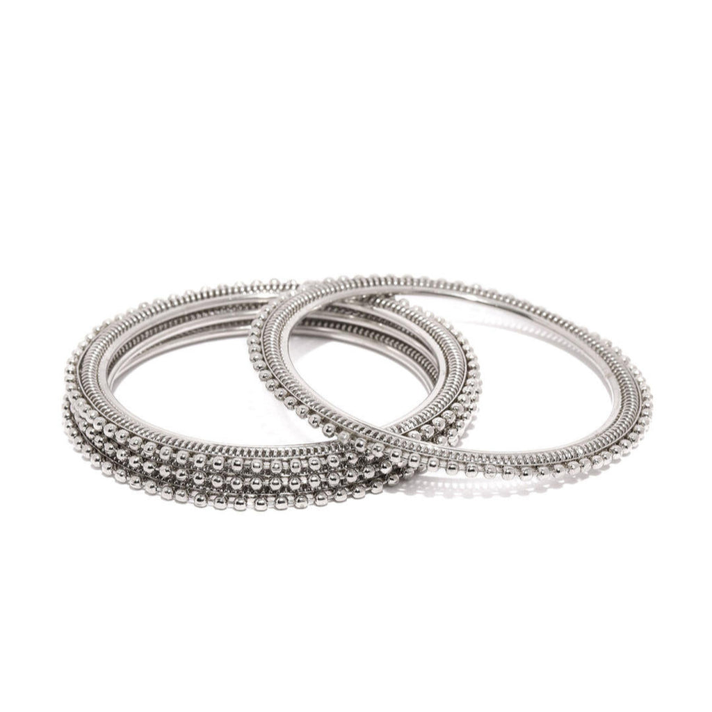 Set of 4 silver-plated textured bangles with intricate detailing, elegant ethnic jewellery for women, perfect for weddings, parties, and traditional Indian outfits