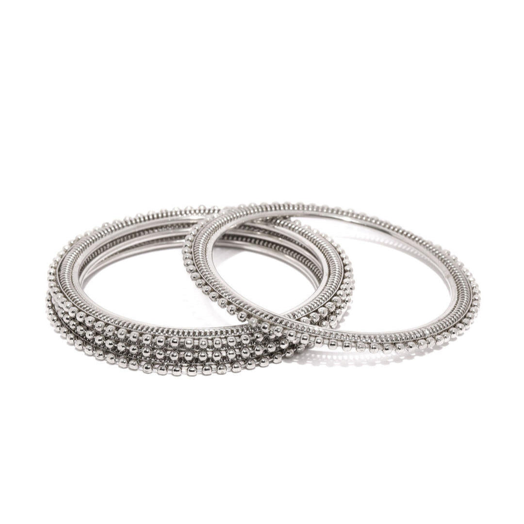 Set of 4 silver-plated textured bangles with intricate detailing, elegant ethnic jewellery for women, perfect for weddings, parties, and traditional Indian outfits